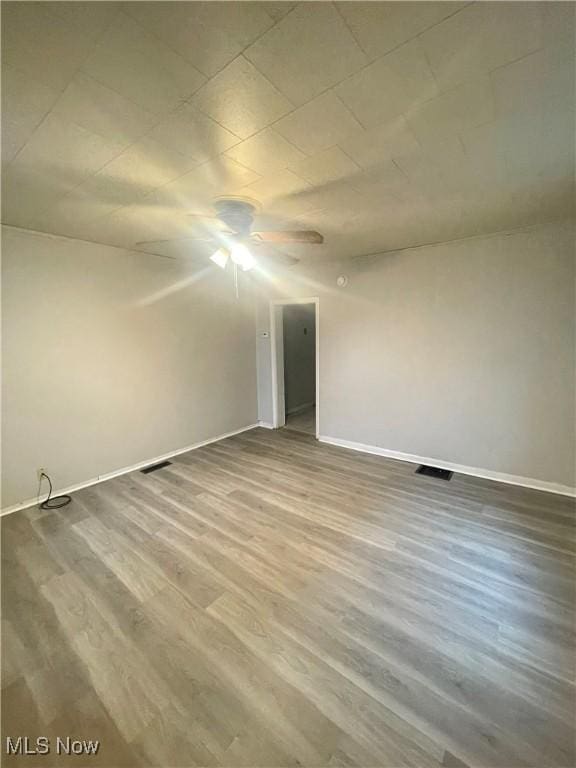 spare room featuring hardwood / wood-style flooring