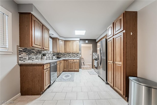 kitchen featuring appliances with stainless steel finishes and backsplash