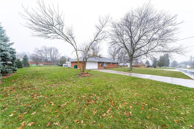 view of yard featuring a garage