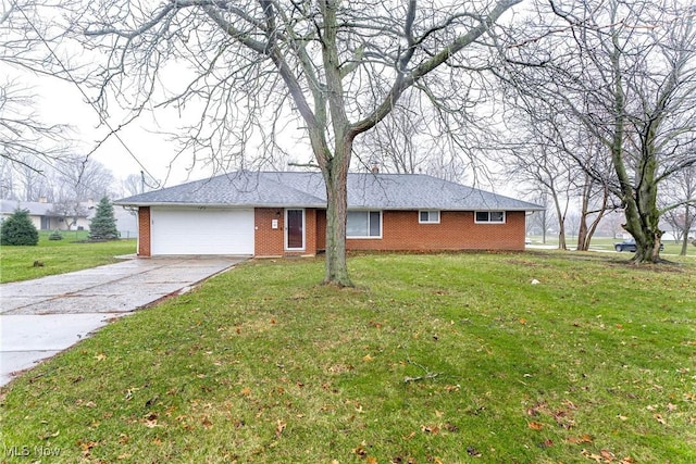 single story home with a front yard and a garage