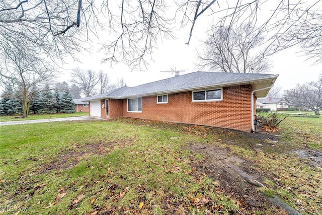 view of property exterior featuring a lawn and a garage