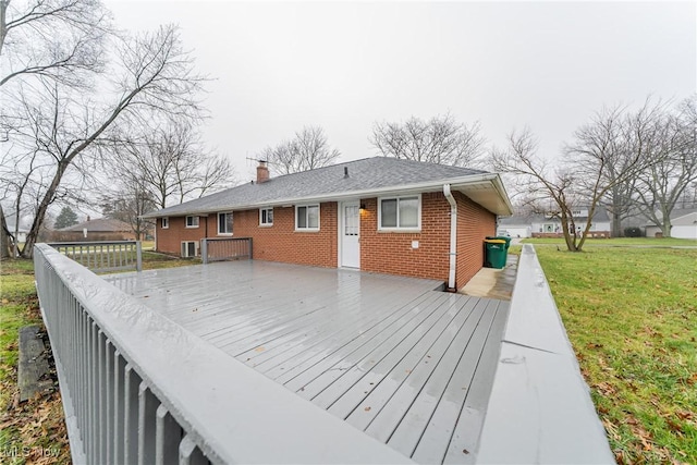 deck featuring a lawn