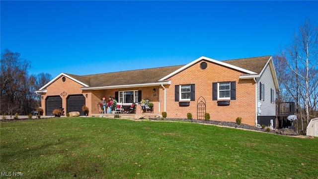 ranch-style house featuring a garage and a front yard