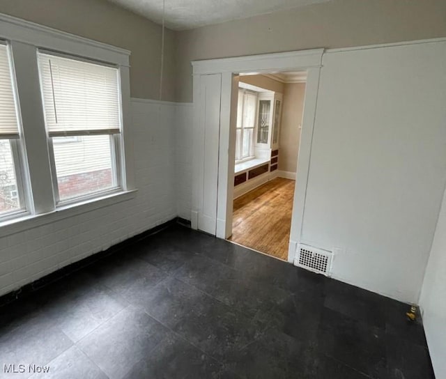 unfurnished room featuring dark wood-type flooring