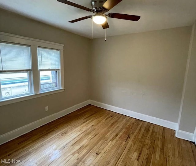 empty room with light hardwood / wood-style floors and ceiling fan