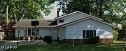 view of front of house with a front lawn