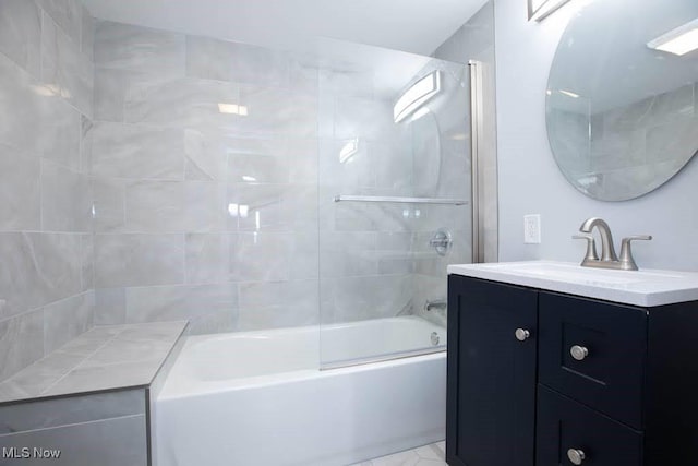 bathroom with shower / bath combination with glass door and vanity