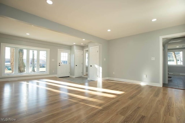 unfurnished living room with light hardwood / wood-style flooring