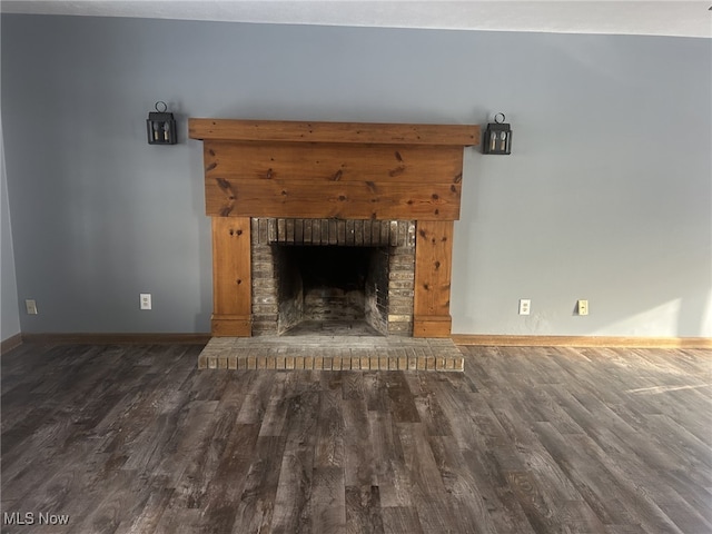 interior details featuring a fireplace and hardwood / wood-style flooring