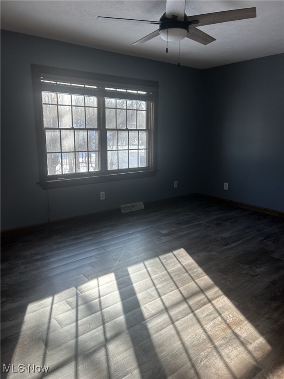 spare room featuring ceiling fan and wood-type flooring