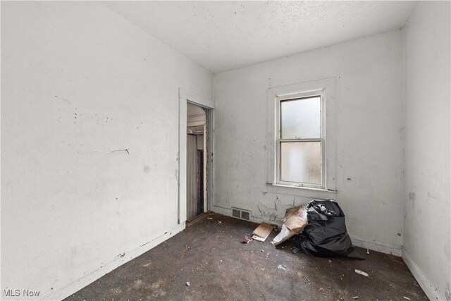 spare room featuring visible vents