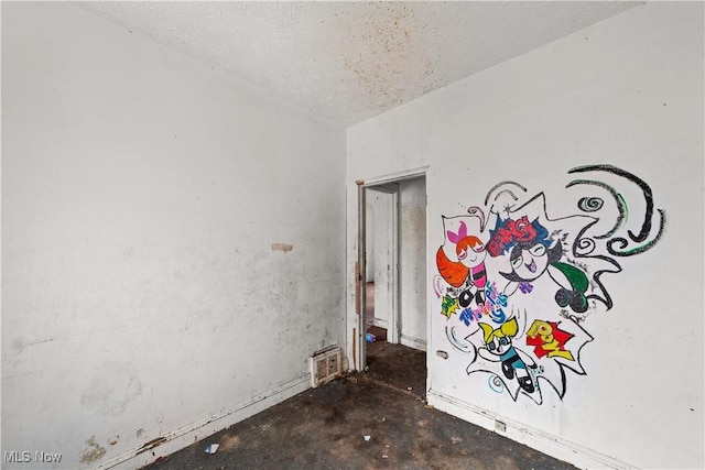 empty room featuring unfinished concrete flooring