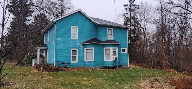 exterior space with a yard and cooling unit