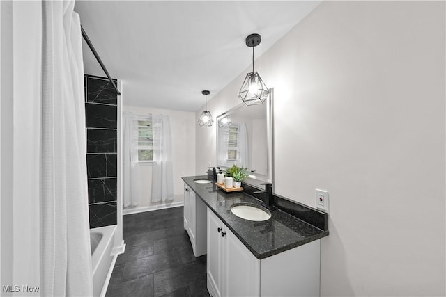 bathroom featuring shower / bathtub combination with curtain and vanity