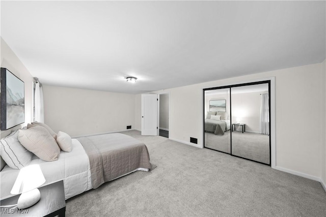 bedroom with light colored carpet