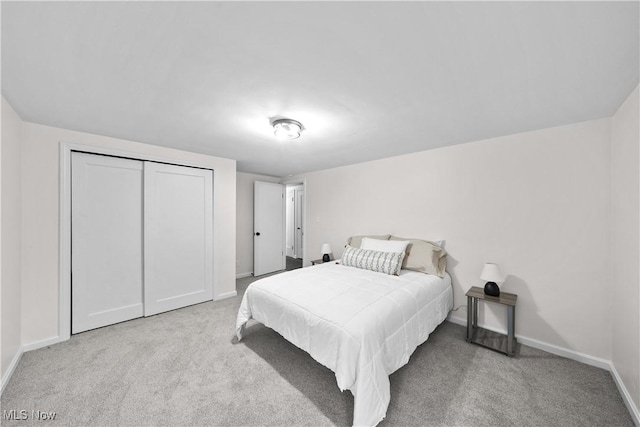 carpeted bedroom with a closet