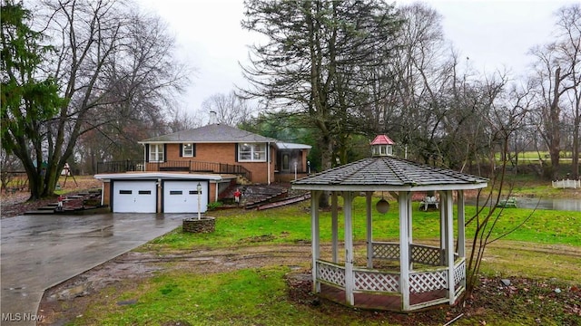 view of yard with a gazebo and a garage