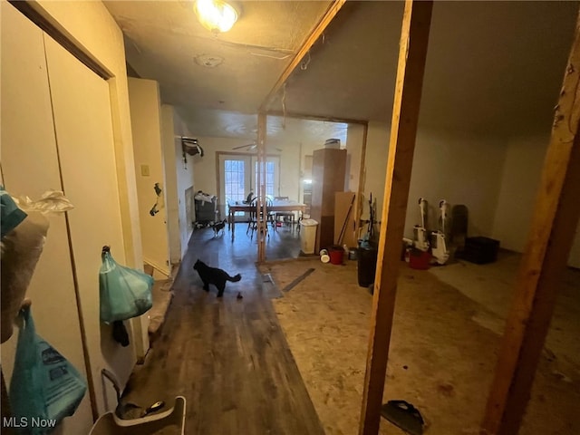 hall with french doors and dark hardwood / wood-style floors