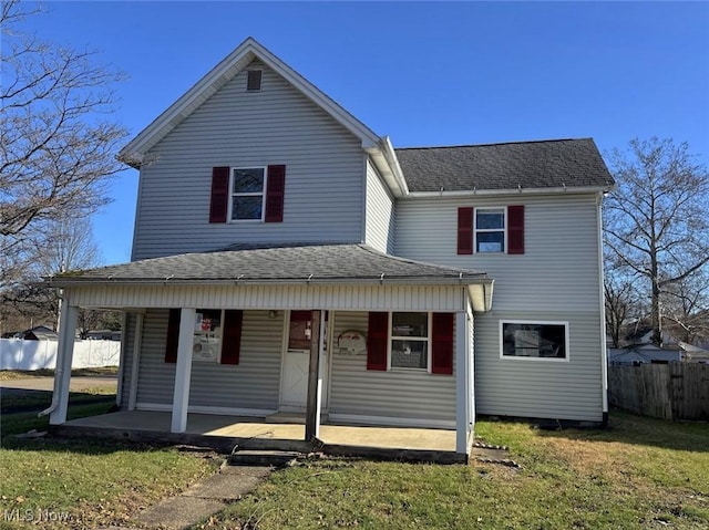 view of front of home with a porch and a front yard