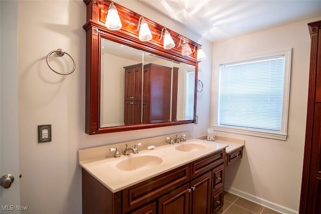 bathroom featuring tile patterned flooring and vanity