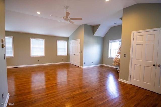 interior space with ceiling fan, vaulted ceiling, and hardwood / wood-style flooring