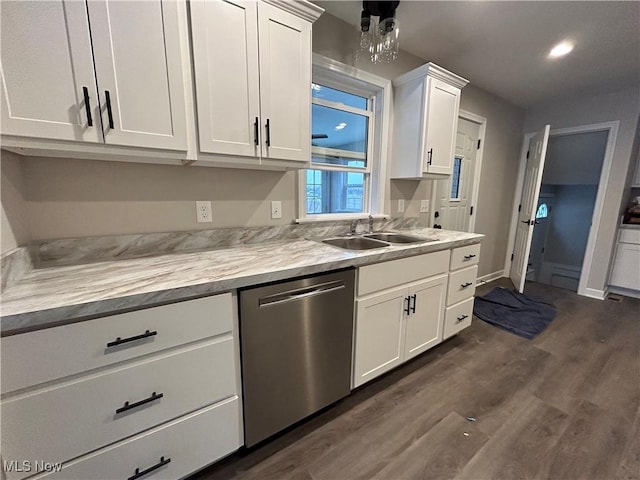 kitchen featuring white cabinetry, stainless steel dishwasher, dark wood-type flooring, and sink