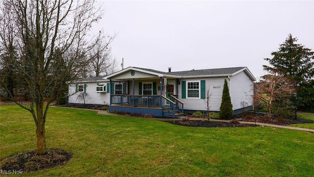 single story home with covered porch and a front lawn