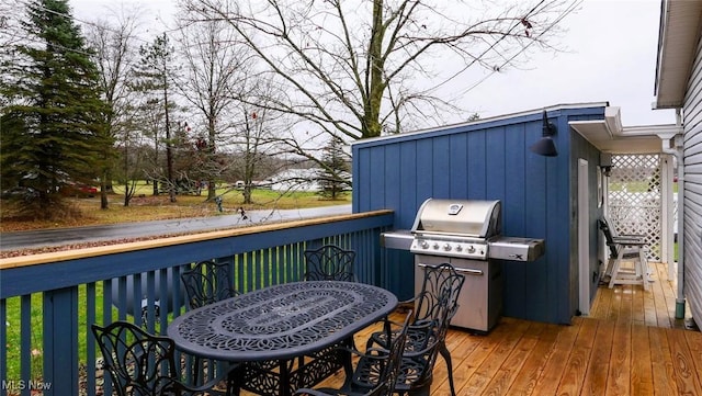 wooden deck with area for grilling