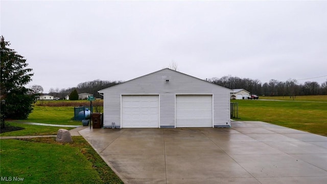 garage featuring a yard