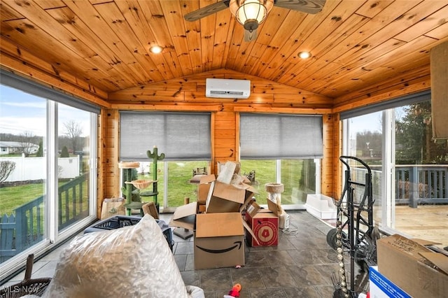 sunroom / solarium featuring lofted ceiling, a wall unit AC, a healthy amount of sunlight, and wood ceiling