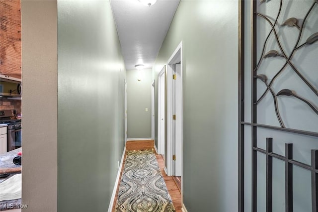 corridor featuring light wood-type flooring