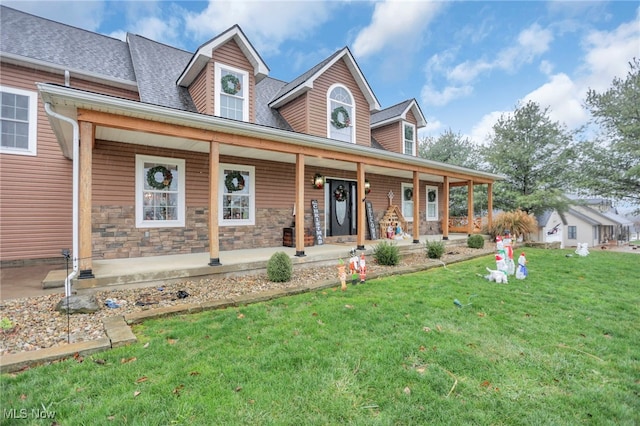 view of front of house with covered porch and a front yard