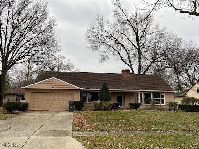 single story home featuring a garage and a front yard