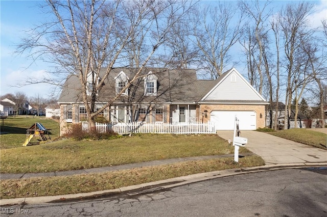 cape cod home with a garage and a front lawn