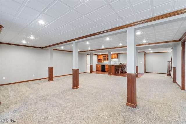 basement featuring light colored carpet and ornamental molding