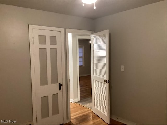 unfurnished bedroom with light hardwood / wood-style floors and a closet