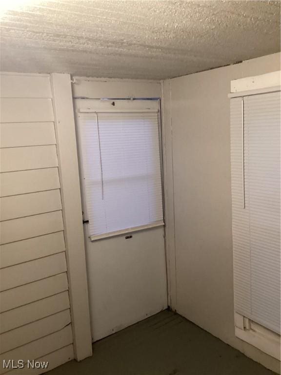 spare room with a textured ceiling