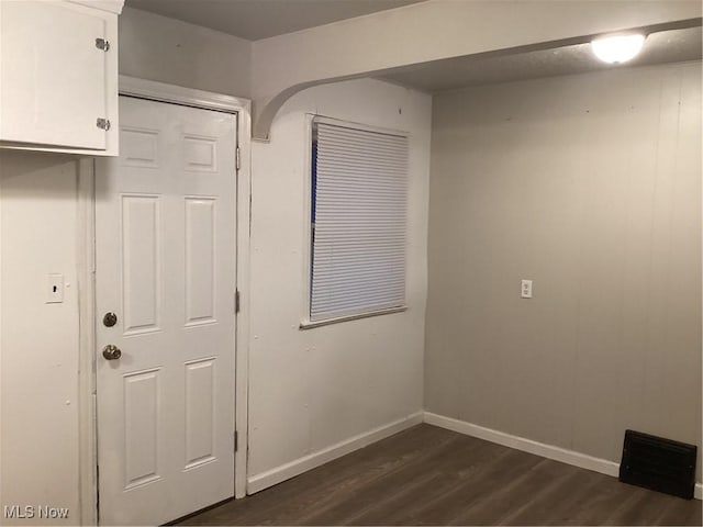 interior space with dark hardwood / wood-style floors