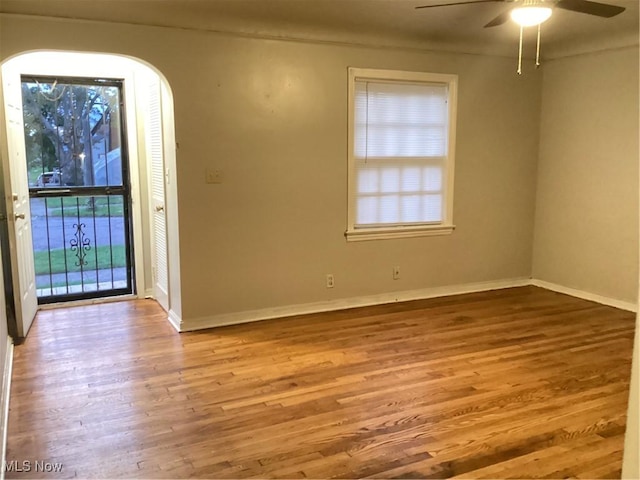 unfurnished room featuring ceiling fan and light wood-type flooring