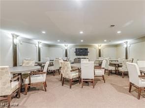 view of carpeted dining space