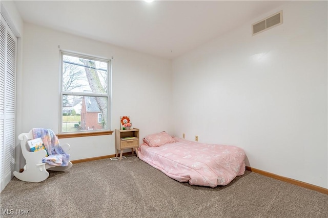 bedroom featuring carpet