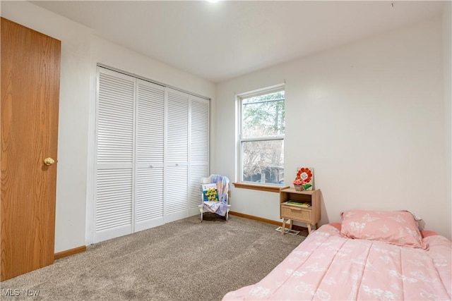 carpeted bedroom featuring a closet