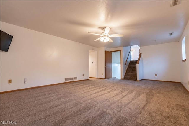 unfurnished living room featuring carpet and ceiling fan