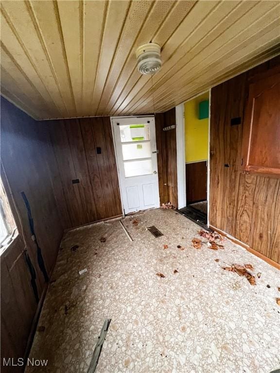 interior space featuring wood walls