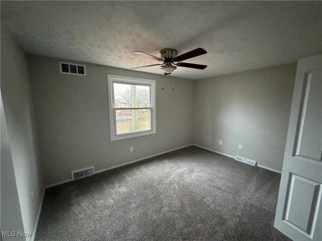 carpeted empty room featuring ceiling fan