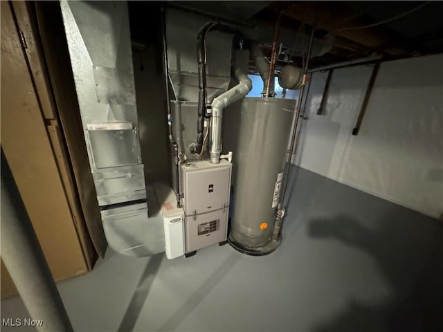 utility room featuring water heater