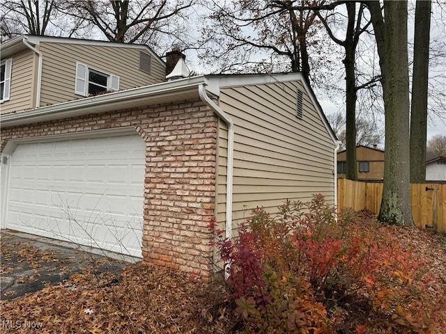 view of property exterior with a garage