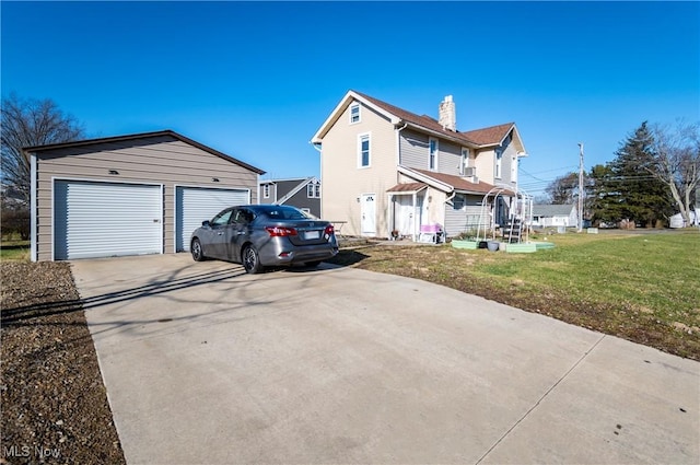 view of front facade with a garage and a front lawn