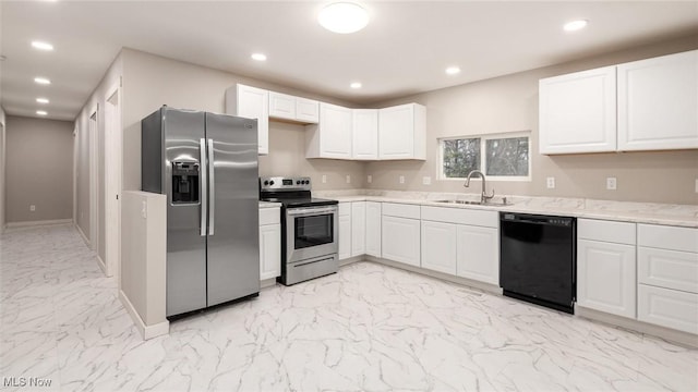 kitchen with light stone countertops, stainless steel appliances, white cabinetry, and sink