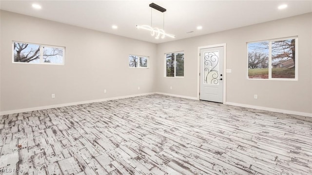 spare room with light wood-type flooring